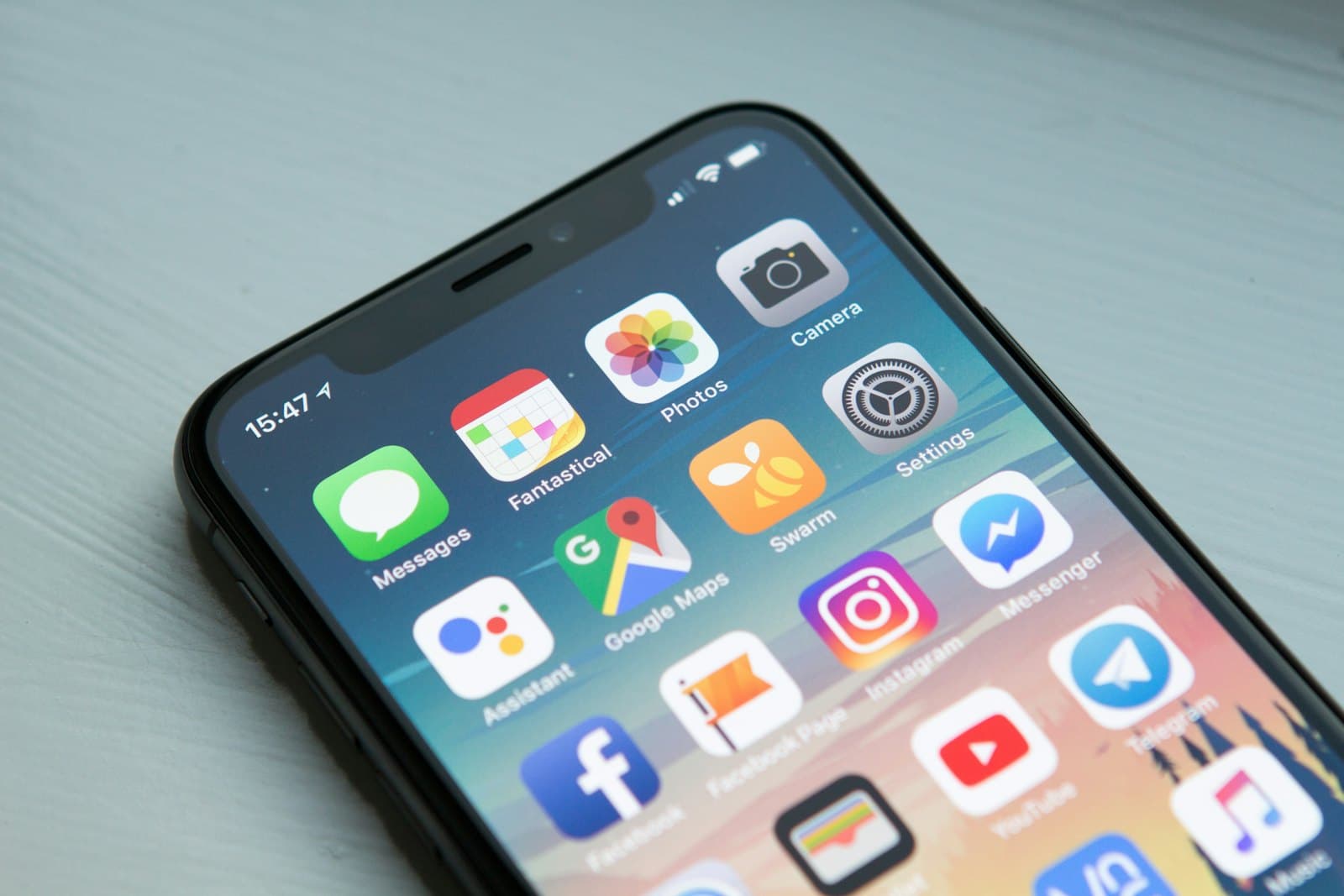 Smartphone home screen filled with mobile apps