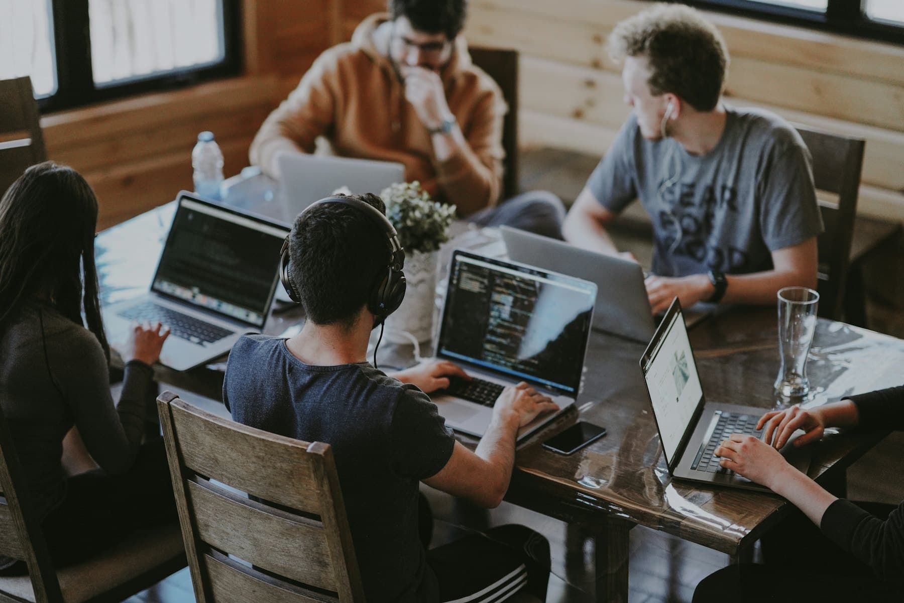 Developers working together around laptops in a shared studio